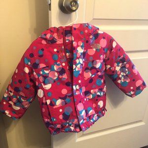 The North Face Girls mutli color coat with hood.